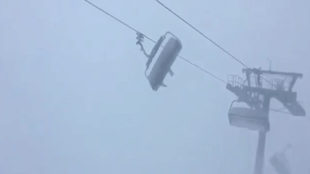 Skiers stuck on terrifying lift with seats blown side to side