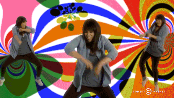 Abbi Jacobson from Broad City dances against a colourful background
