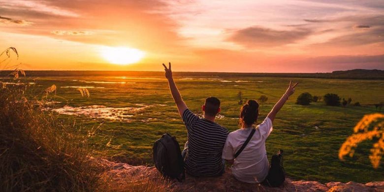 A couple watching the sunset in Kakadu National Park in the Northern Territory