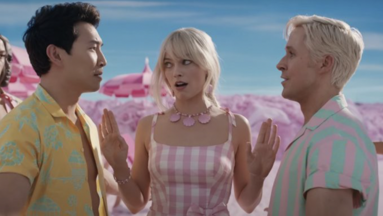 Margot Robbie as Barbie and Simi Liu and Ryan Gosling as Ken