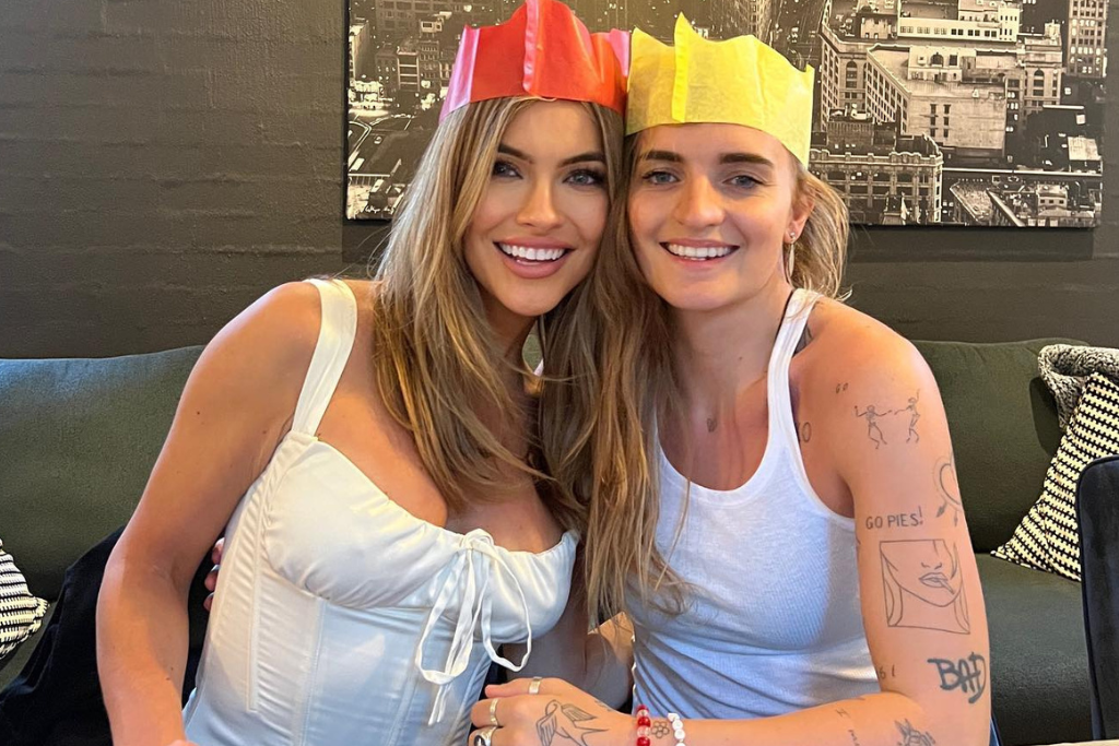 Chrishell Stause and G Flip with paper hats