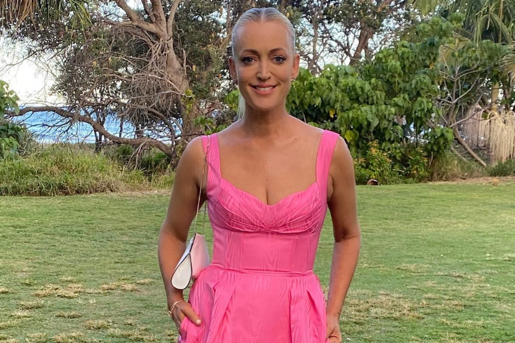 Jackie 'O' Henderson in a pink dress